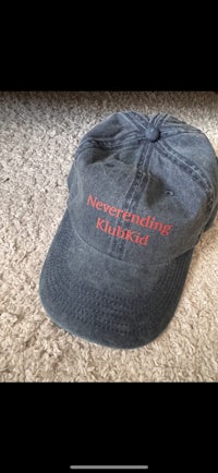 a baseball cap with the word'neverending chicken'embroidered on it